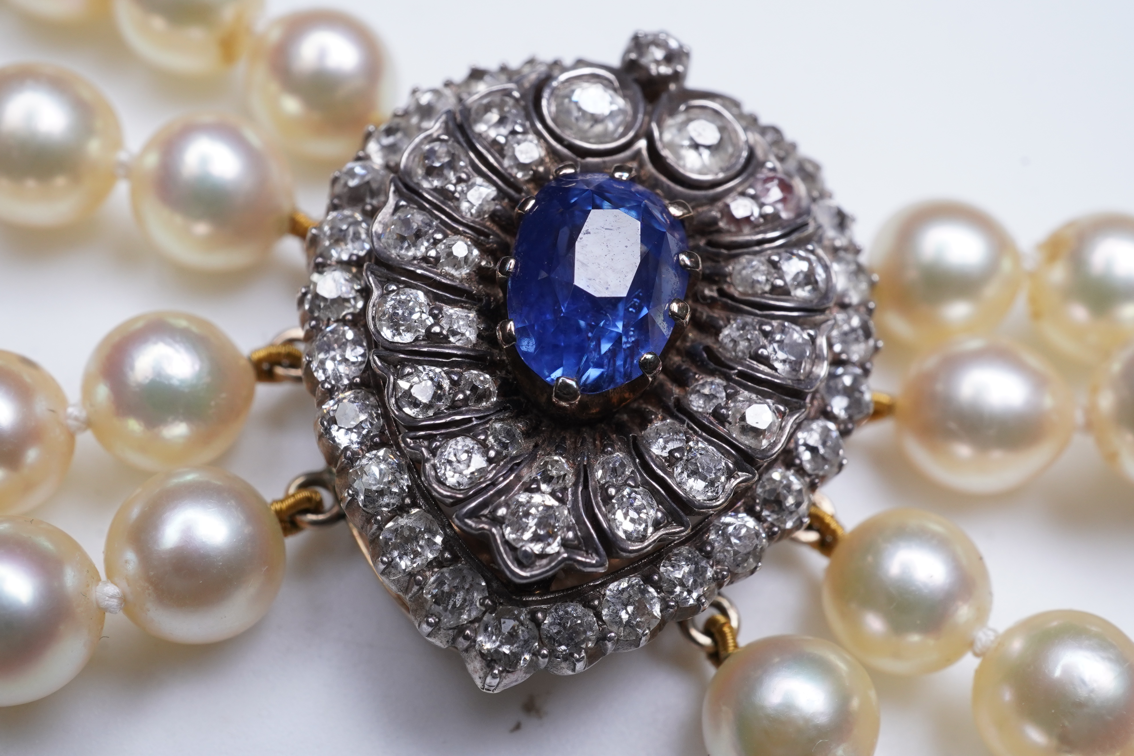 A late Victorian sapphire and diamond brooch and cultured pearl necklace, circa 1900 and later